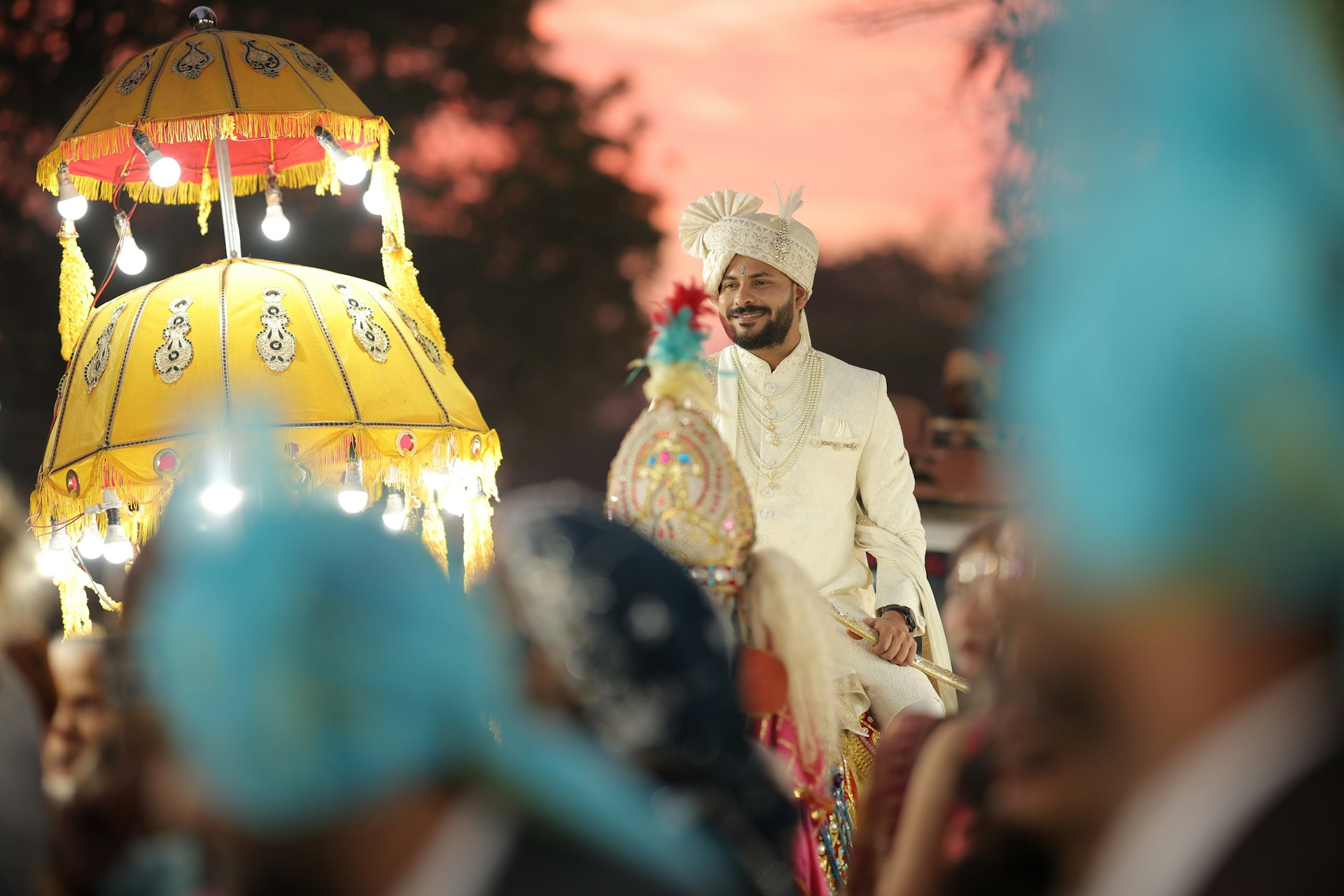 A man in a turban walking down a street